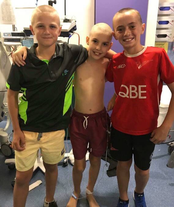 Best friends: Jet with Reilly Caswell, left, and Eli Oldfield. Jet's mates have visited him in hospital, at home and stayed in touch through his ordeal.