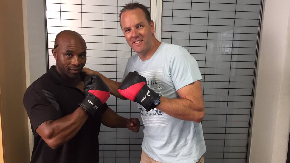 Horatius Feni (H for short) with Superintendent Chris Craner who coordinated a Port Stephens effort to deliver new boxing gear to a gym in South Africa.