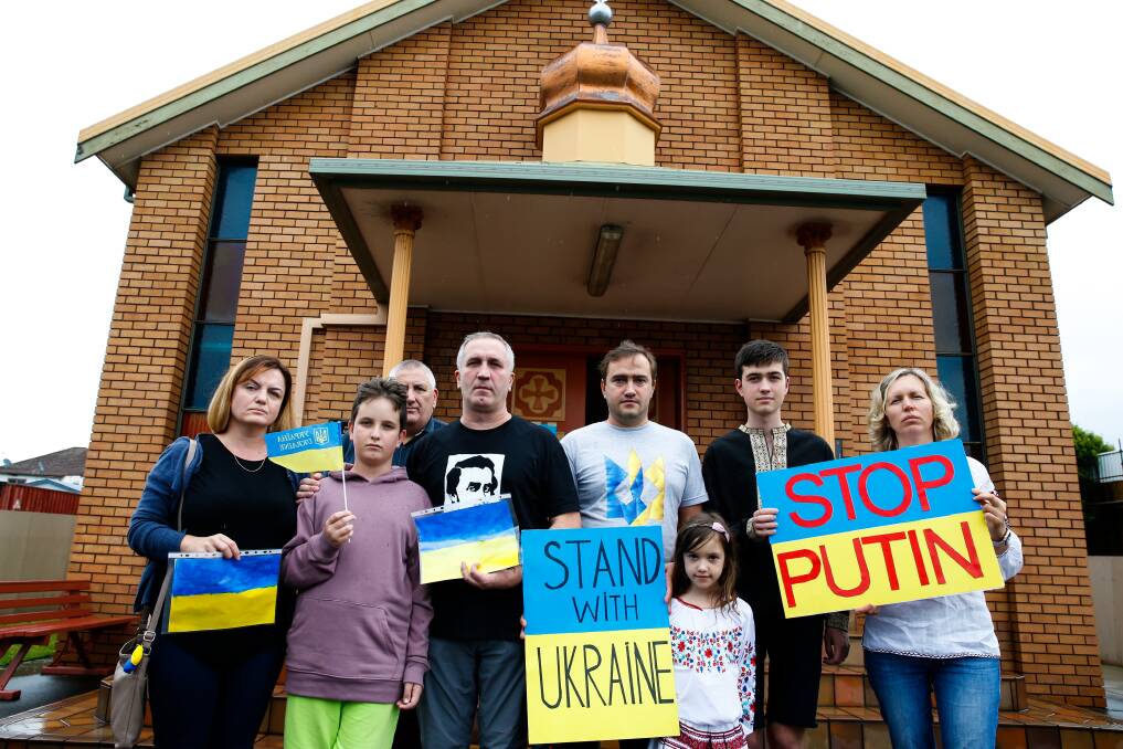Ukrainian expats were united in grief at a Wollongong church on Sunday. Picture: Anna Warr