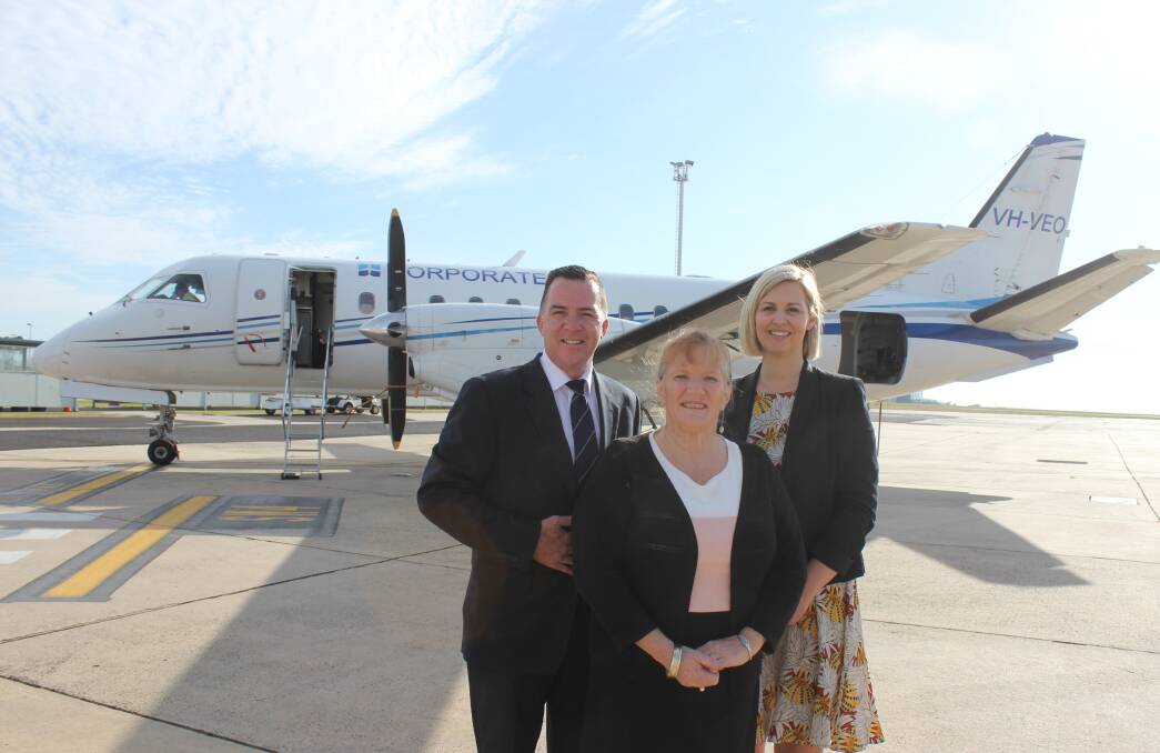 Pleased: Fly Corporate Geoff Woodham, Shellharbour mayor Marianne Saliba and Essendon Fields marketing manager Nadia Salajic after the first flight to Melbourne. Picture: Ashleigh Tullis