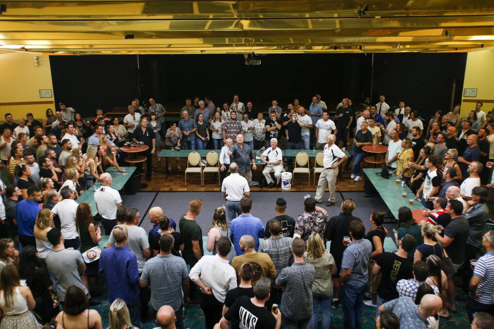 Hundreds gathered to enjoy games of two-up at The Builders Club on Anzac Day. Picture: Anna Warr
