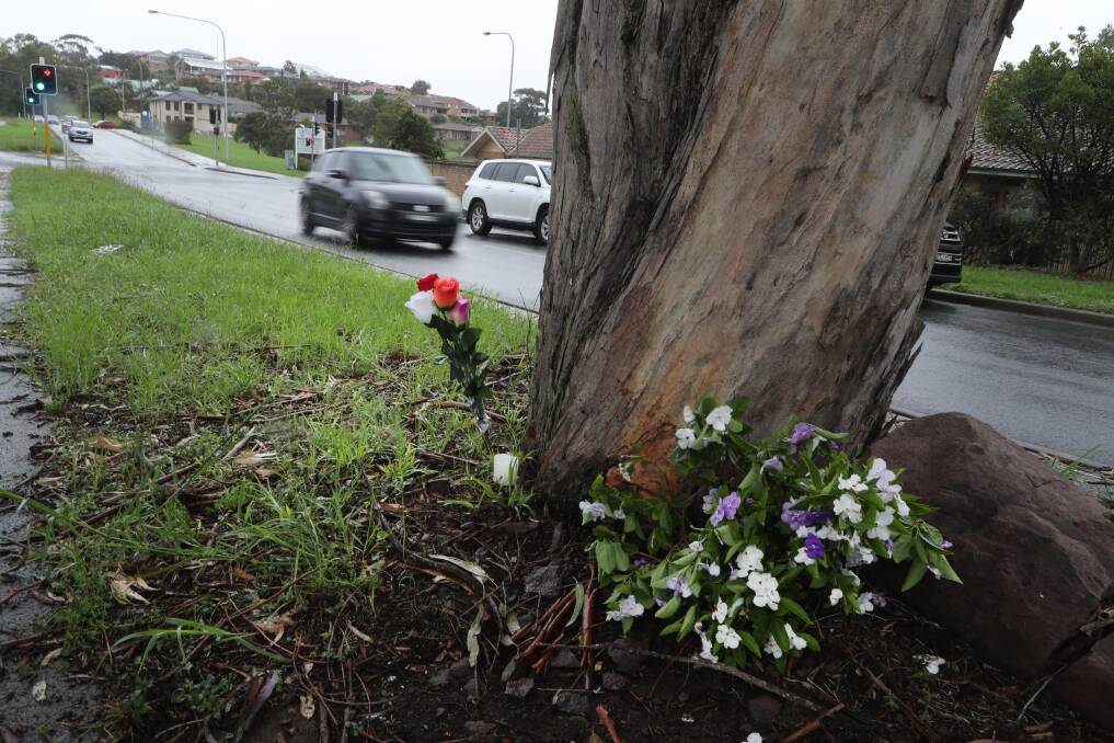 Flowers have been left at the site of the crash on Wattle Road. Picture: Robert Peet
