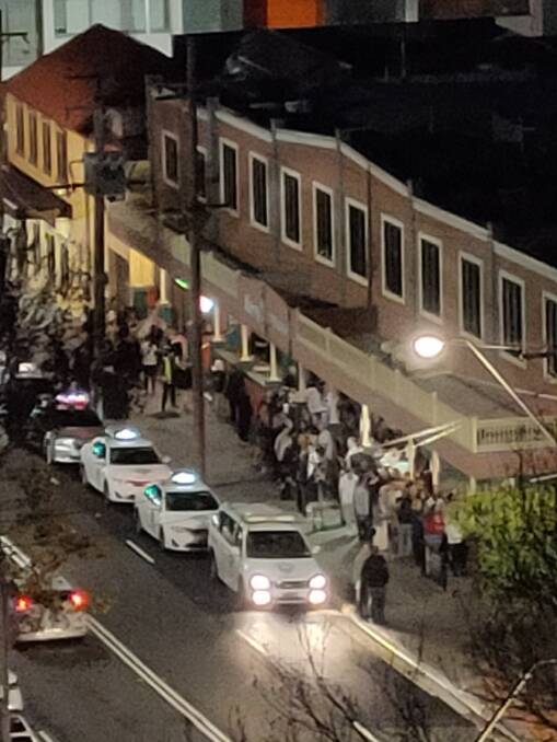 Another neighbour captured the long, not-socially-distancing queue outside the Harp Hotel. Picture: Supplied