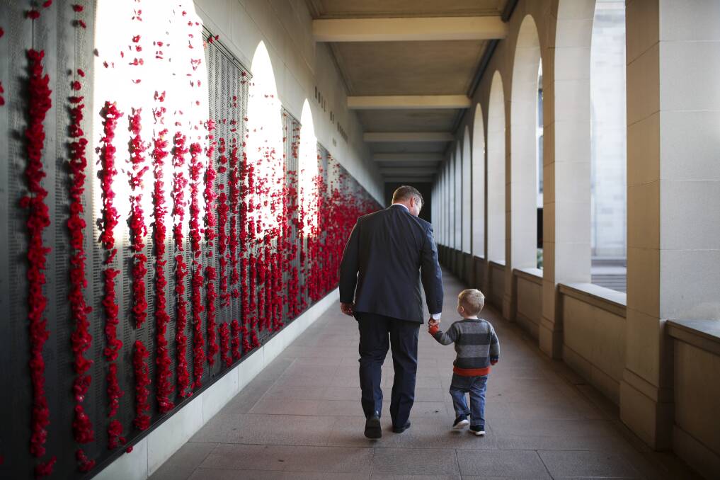 Paying respects: The Anzac Day commemorative service will be broadcast live from the Australian War Memorial with people encouraged to tune it. File photo: Alex Ellinghausen