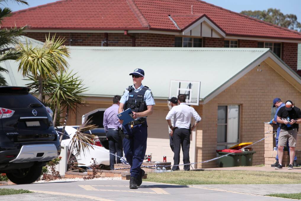Police officer established a crime scene at the Denham Drive house following the shooting at Denham Drive. Picture: Sylvia Liber