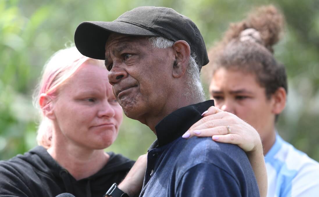 Anguish: Grieving father Fred Tallis, comforted by neighbour Michelle Pulley, is remembering his son as a "little warrior" after he was tragically killed when his bike collided with a car at Shellharbour City Centre. Picture: Robert Peet