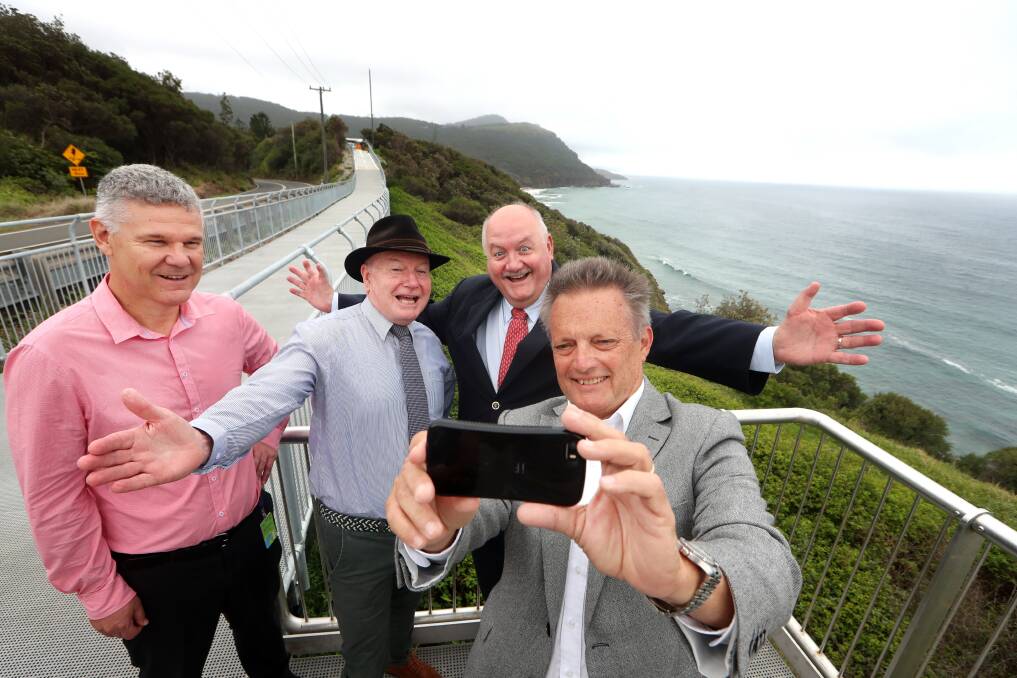 Postcard perfect: Wollongong City Council general manager David Farmer, Lord Mayor Gordon Bradbery, Heathcote MP Lee Evans and councillor Leigh Colacino took a selfie in front of the iconic Stanwell Park coastline. Picture: Sylvia Liber.