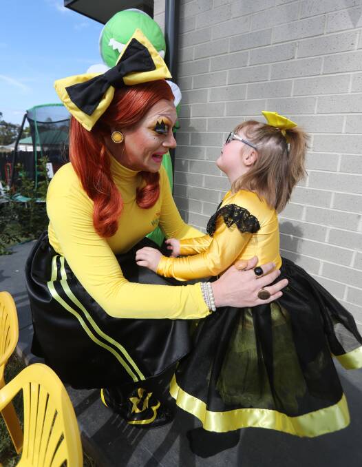 Siblings: Olivia was surprised and happy to see Roxee Horror dressed up as Emma Wiggle during her fifth birthday party.