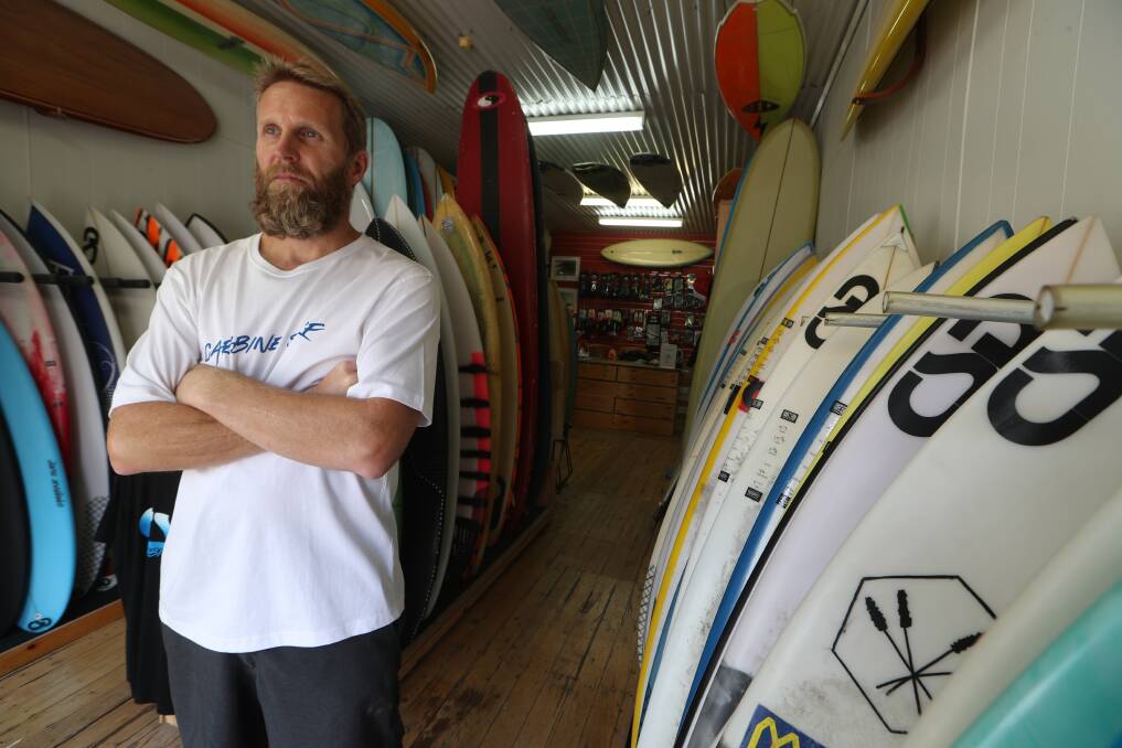 Inconvenient expense: Carabine Surf owner Shane Hornby is frustrated a man broke into his store's shed to steal a surfboard. Picture: Robert Peet