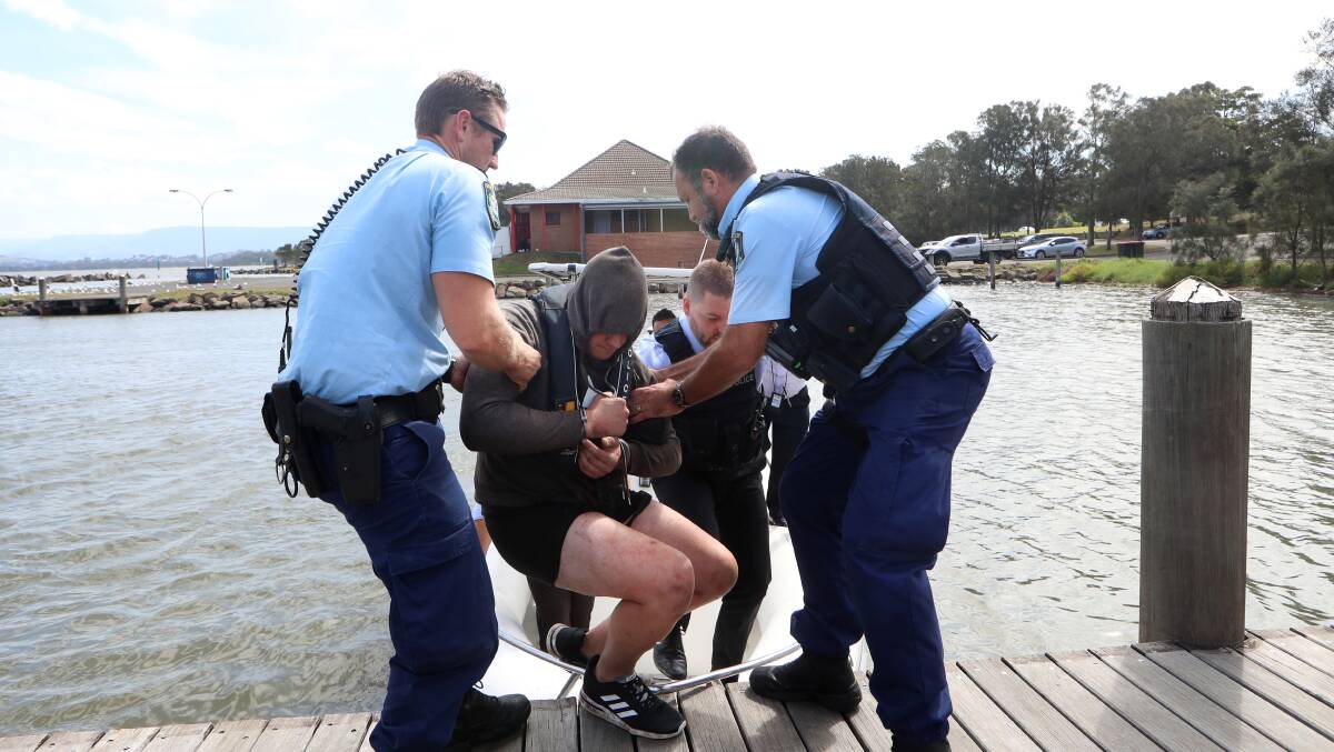 Caught: A man who swum to Hooka Island in Lake Illawarra in an attempt to escape police has been taken into custody.. Pictures: Sylvia Liber. Pictures: Sylvia Liber