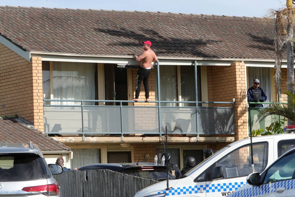 Onlookers could see Joshia Dendulk out on his balcony and climbing the railing at points during the stand off. Picture: Sylva Liber