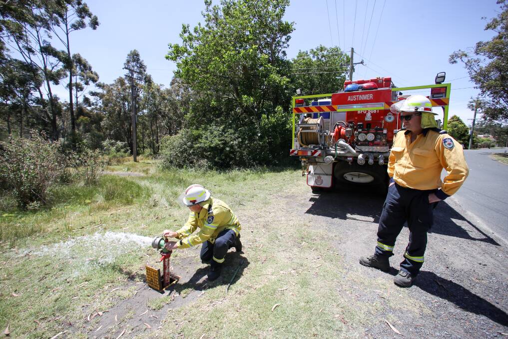 Members of the Austinmer crew checked hydrants in Helensburgh during patrols in case they needed to access water. Picture: Adam McLean