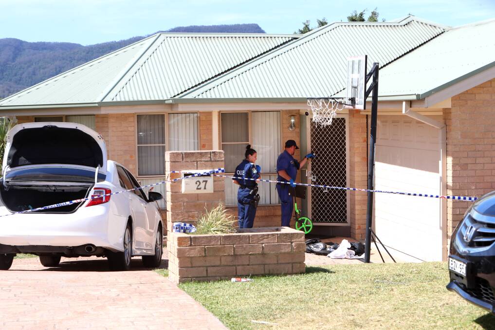 Crime scene officers collected evidence following the shooting at Denham Drive. Picture: Sylvia Liber