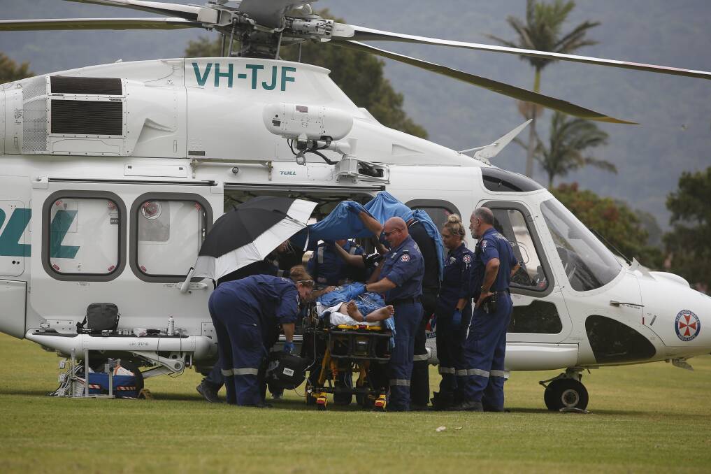 A man suffering from a stab wound was treated by paramedics and airlifted to hospital on November 30. Picture: Anna Warr