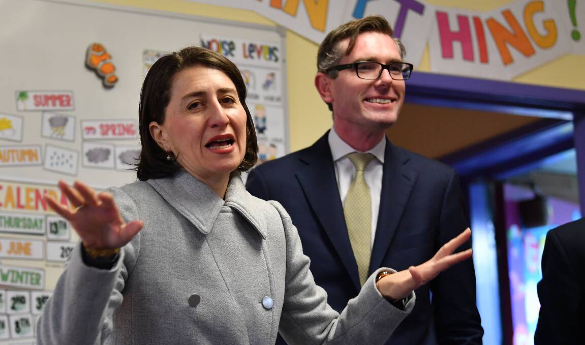 Premier Gladys Berejiklian and treasurer Dominic Perrottet announced 2500 public service jobs would be cut in the budget. Picture: AAP/Dean Lewins