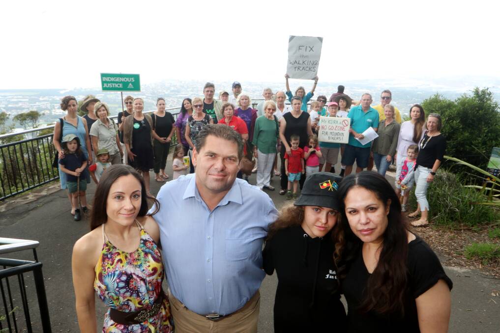 United: Illawarra Local Aboriginal Land Council's Tehla Bowe and Paul Knight, singer Christine Anu and daughter Zipporah Corser-Anu with community groups representatives oppose mountain biking on Mt Keira. Picture: Sylvia Liber. 