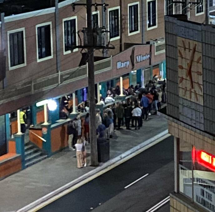 Too many people: A nearby neighbour took a photo of the line of patrons outside the Harp Hotel not social distancing about 10pm on Saturday night. Picture: Supplied