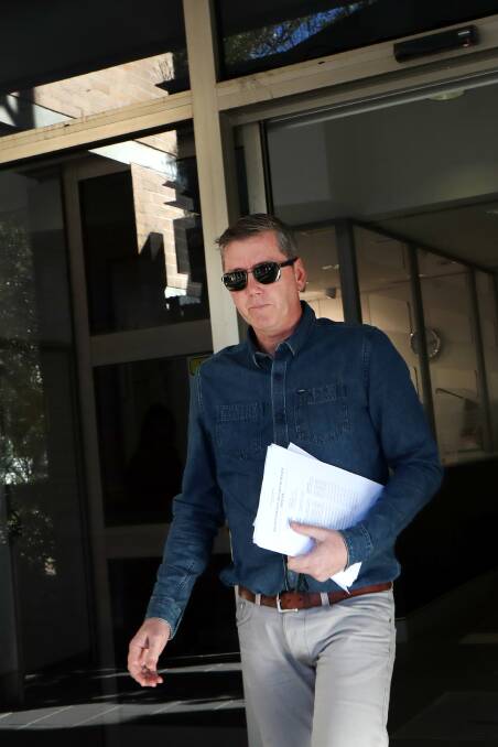 Charged: Matthew Hanks avoided waiting media after he left Wollongong Police Station. Picture: Sylvia Liber