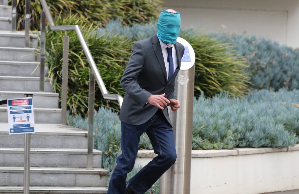 Hiding in plain sight: Convicted drink spiker Arthur Moulton, 61, leaves Wollongong Courthouse yesterday.