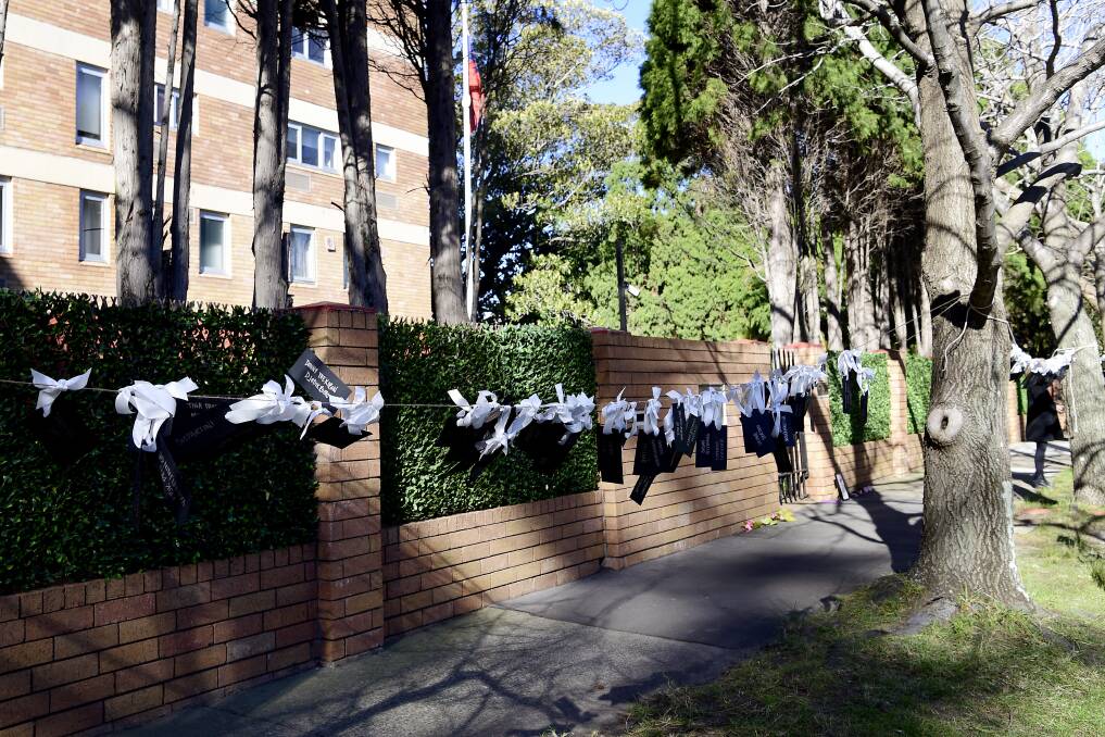 Tags with the names of all 298 passengers who lost their lives onboard MH17 are seen hanging between trees out the front of the Consulate General of the Russian Federation building in Sydney. Picture: Bianca De Marchi