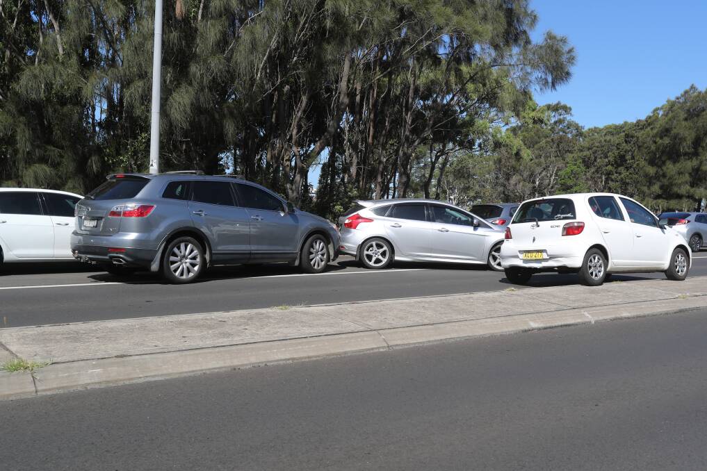 Tense stand off: Two drivers refused to move their cars from a parking spot on George Hanley Drive on January 1. Picture: Robert Peet