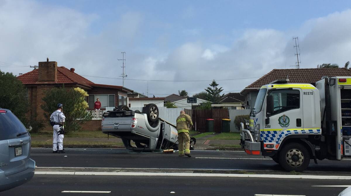 The driver of a ute hit a telegraph pole and flipped his car. Picture: Sylvia Liber