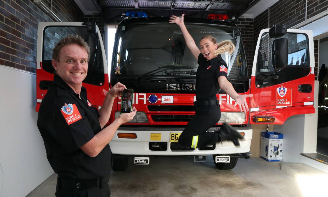 Firefighters Paul Dorin and Maddison Todman are ready to show people around Corrimal fire station during online activities for the Fire and Rescue open day. Picture: Robert Peet