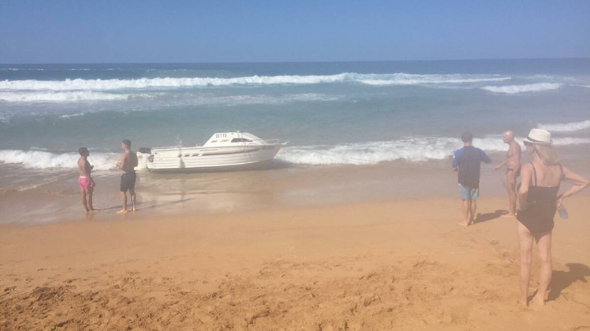 A boat capsized at Bombo Beach on Sunday afternoon. Picture: Sylvia Liber