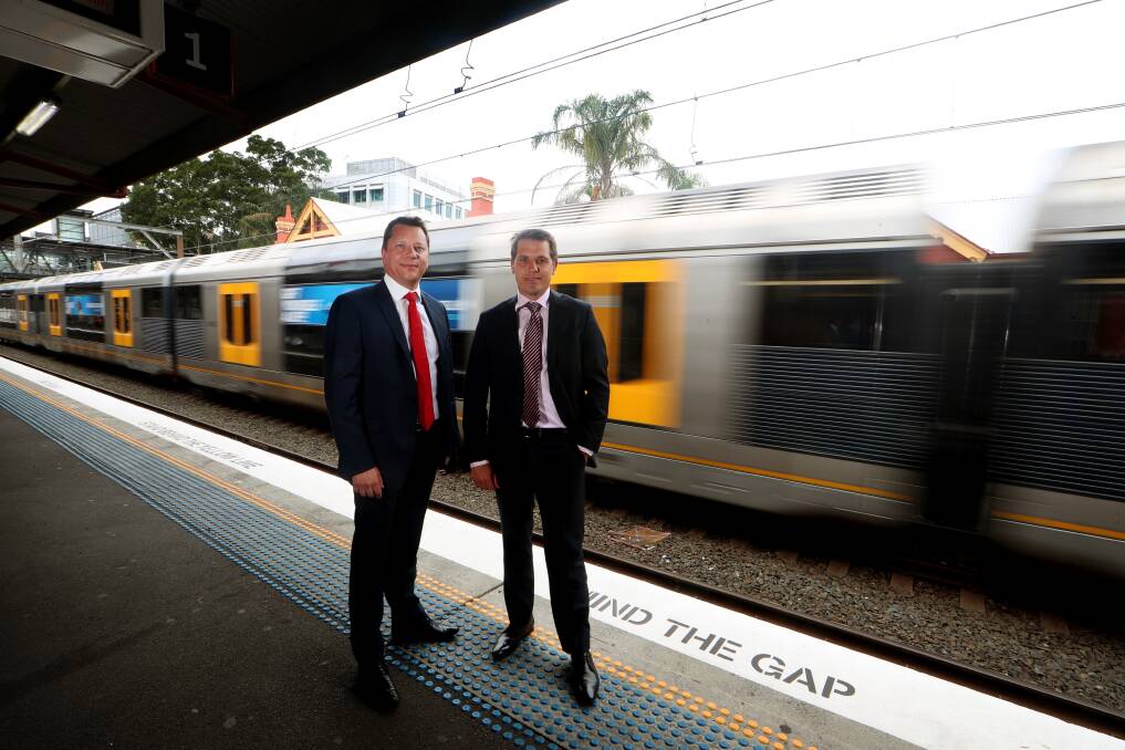 Upgraded: Keira MP Ryan Park and Wollongong MP Paul Scully were pleased two services now have an extra four carriages each from Monday but say the services on the South Coast line still need to be improved. Picture: Sylvia Liber.
