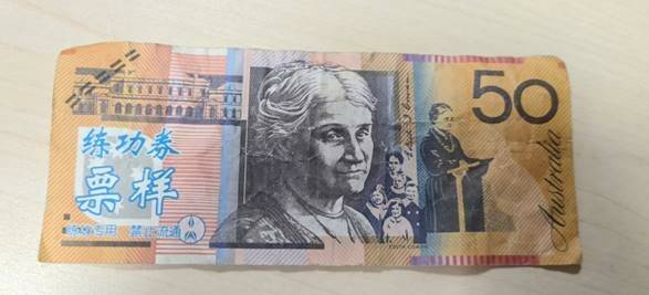 Police are warning business owners and the community to be on the lookout for fake $50 notes, in particular notes clearly marked with blue Asian writing. Picture: Lake Illawarra Police