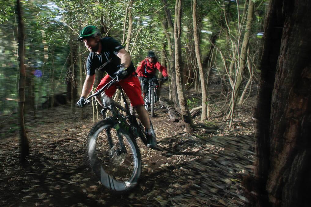 Dirt Art managing director Simon French and mountain biker Jason Lan went for a ride on Mount Keira in 2014 before they completed a feasibility study into creating mountain bike trails. Picture: Adam McLean