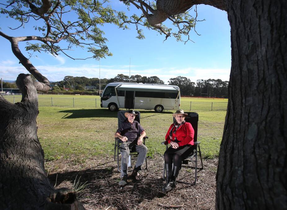 Van life: Shellharbour mayor Marianne Saliba and husband Les Dawes with their campervan they have used to travel around Australia, pictured at Scout Willoughby cricket pitch. Picture: Robert Peet.