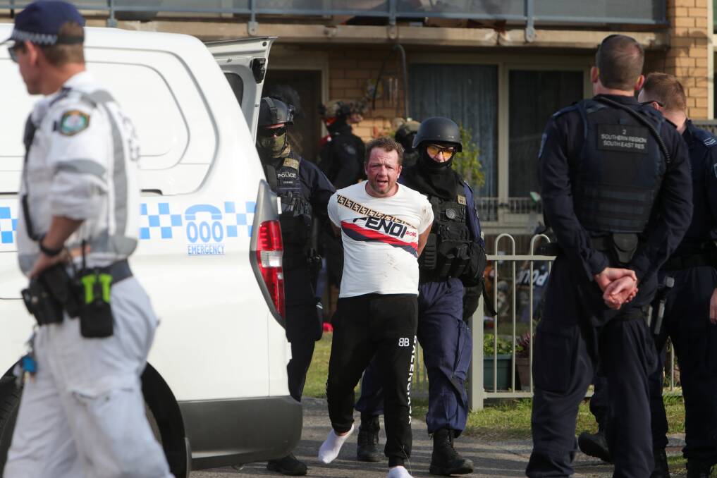 Joshua Dendulk was taken to hospital for assessment before being returned to Wollongong Police Station where he was charged. Picture: Sylvia Liber
