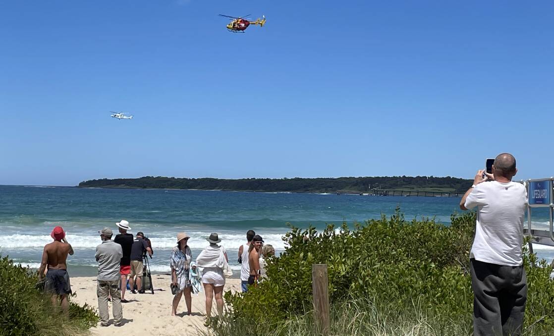 Two helicopters are looking for the missing swimmer. Picture: Robert Peet