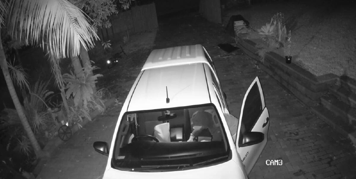 A thief can be seen looking for valuables in a Wombarra resident's car on the weekend. Picture: NSW Police
