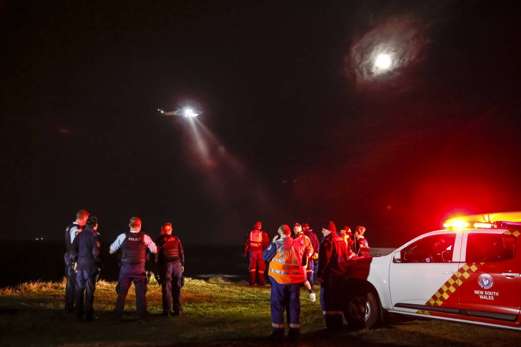 A Toll rescue helicopter searched for the missing man and child in the water after their boat capsized off Bulli Point. Picture: Anna Warr