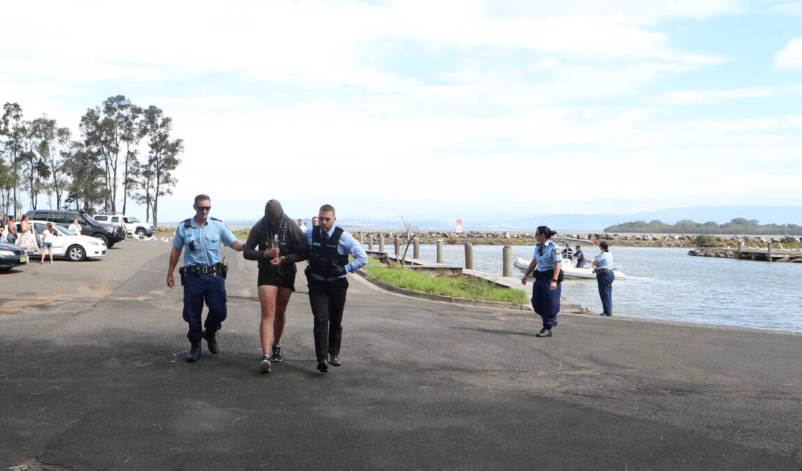 Caught: A man who swum to Hooka Island in Lake Illawarra in an attempt to escape police has been taken into custody.. Pictures: Sylvia Liber