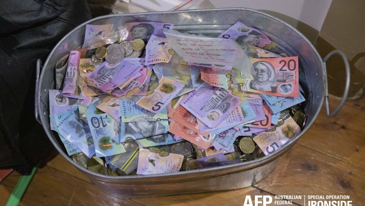 AFP agents allegedly seized cash from Vamvoukakis' home during a search warrant. Picture: AFP