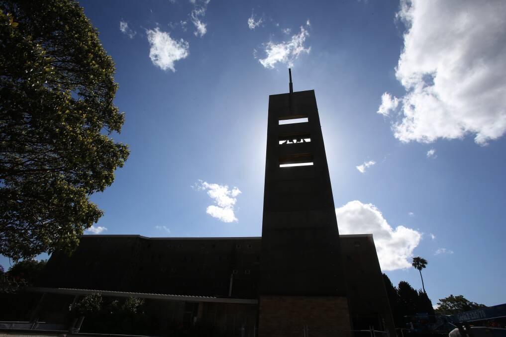 Sky high: The steeple on St Mark’s Anglican Church in Wollongong is coming down because it is structurally unsound. Picture: Robert Peet
