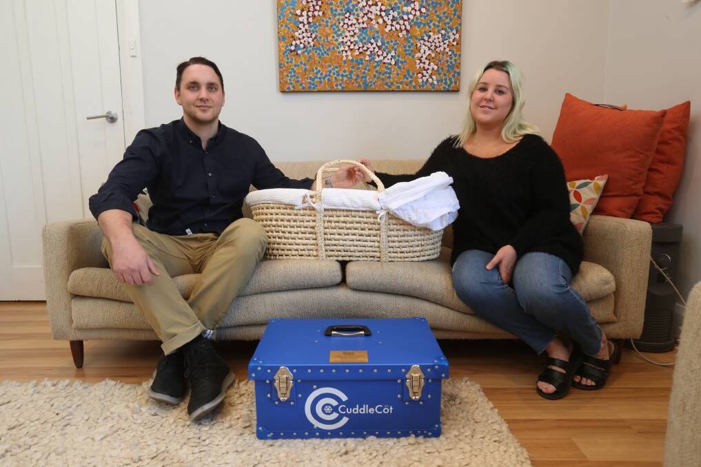 Donation: Geordi Penrose and Ashleigh Charlesworth's son Parker was stillborn. They have raised money to donate a Cuddle Cot to Port Kembla Tender Funerals so other parents have more time with their babies. Picture: Robert Peet