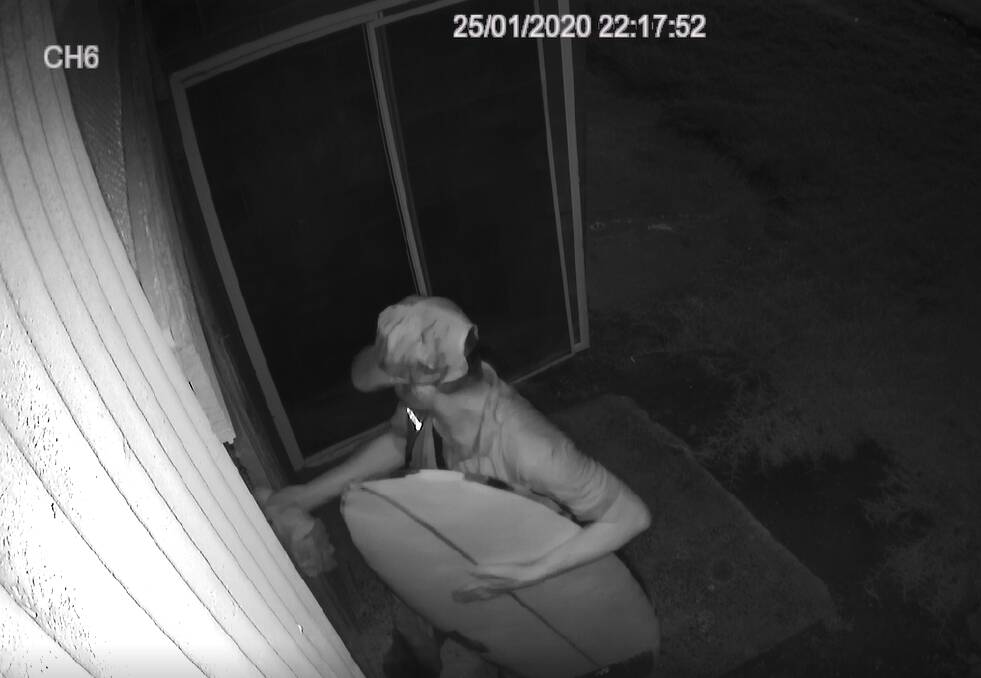 Break-in: CCTV footage captured the alleged thief stealing a surfboard. Picture: Supplied