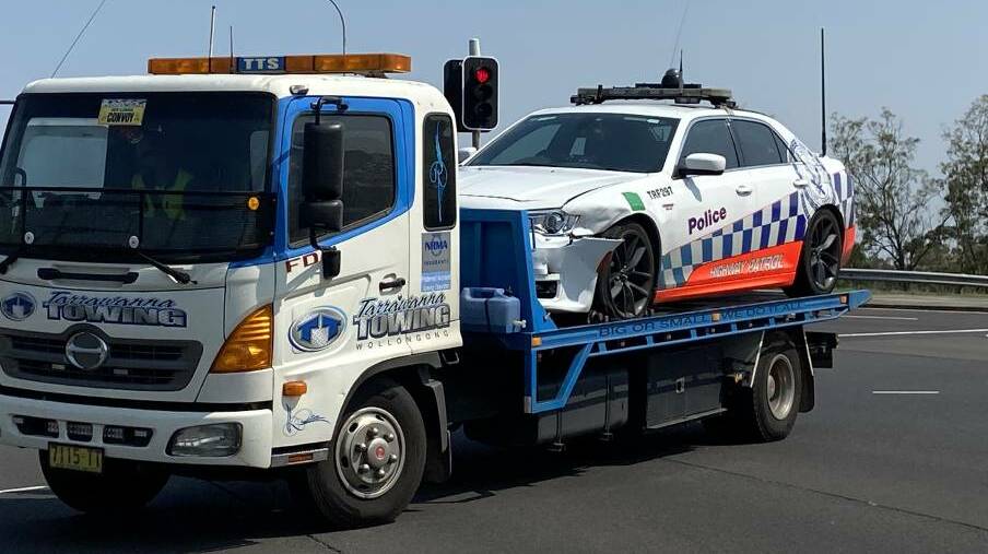 The damaged police vehicle being towed away. Picture: Ashleigh Tullis