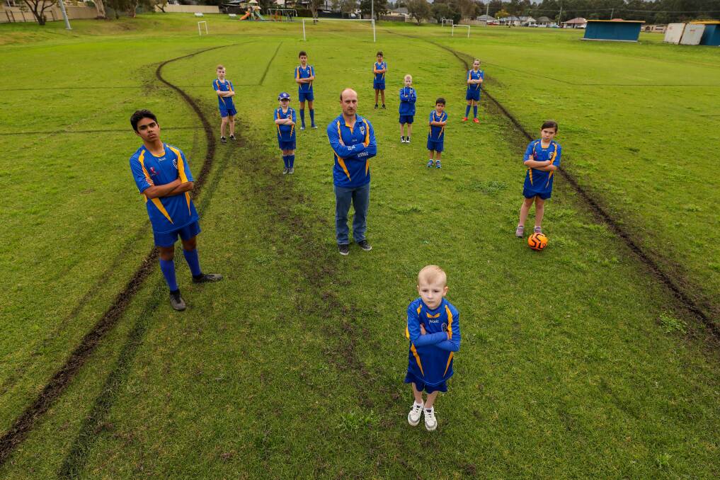 Disheartening: Dapto Phoenix Football Club players and president Ashley Sulcs are disappointed vandals have torn up their field. Picture: Adam McLean