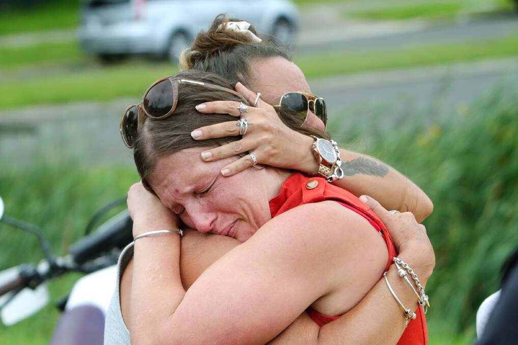 Heatbreak: Emily Voltz hugs Adrian Voltz's mother Andrea Ganitis as they mourn his death. Picture: Sylvia Liber