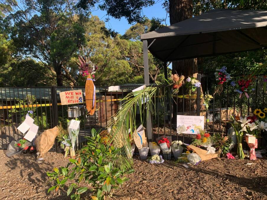 A memorial was placed outside Mr Harris's house off Lawrence Hargrave Drive. Picture: Luke Shanahan