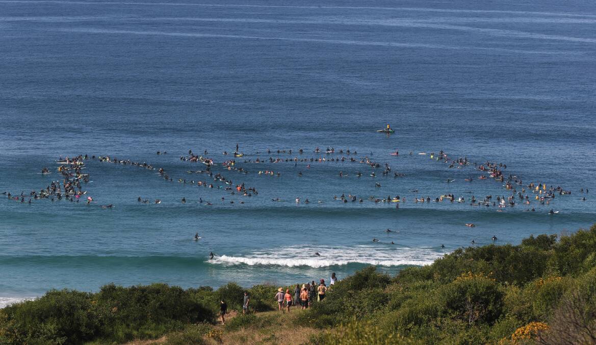 Surfers made a sign in the water that said "no" - clear message to Reflections Holiday Park. Picture: Robert Peet