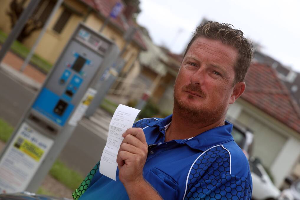 Chris Lewis is furious his partner was issued with a fine when the parking meter was not working. Picture: Robert Peet