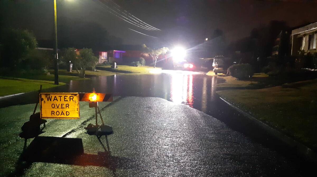 NSW SES Dapto and Wollongong units responded to flooding on Saville Road, Dapto on Tuesday night while the Illawarra Police Rescue Squad carried an injured girl to safety. Picture: NSW SES Dapto and Wollongong units and Illawarra Police Rescue Squad - NSW Police Force Facebook pages