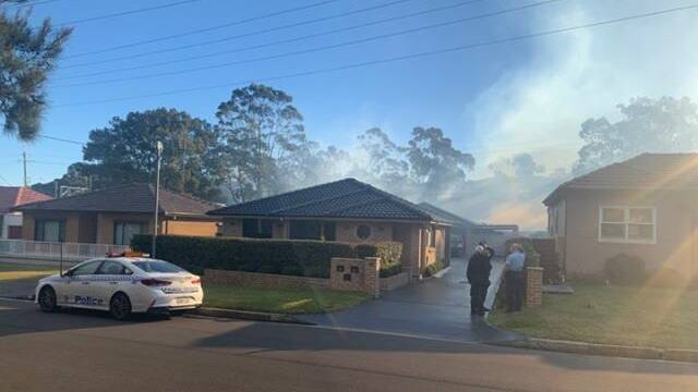 A blue-tinged fire is burning near the Corrimal Cokeworks site. Picture: Alexander Bazzina
