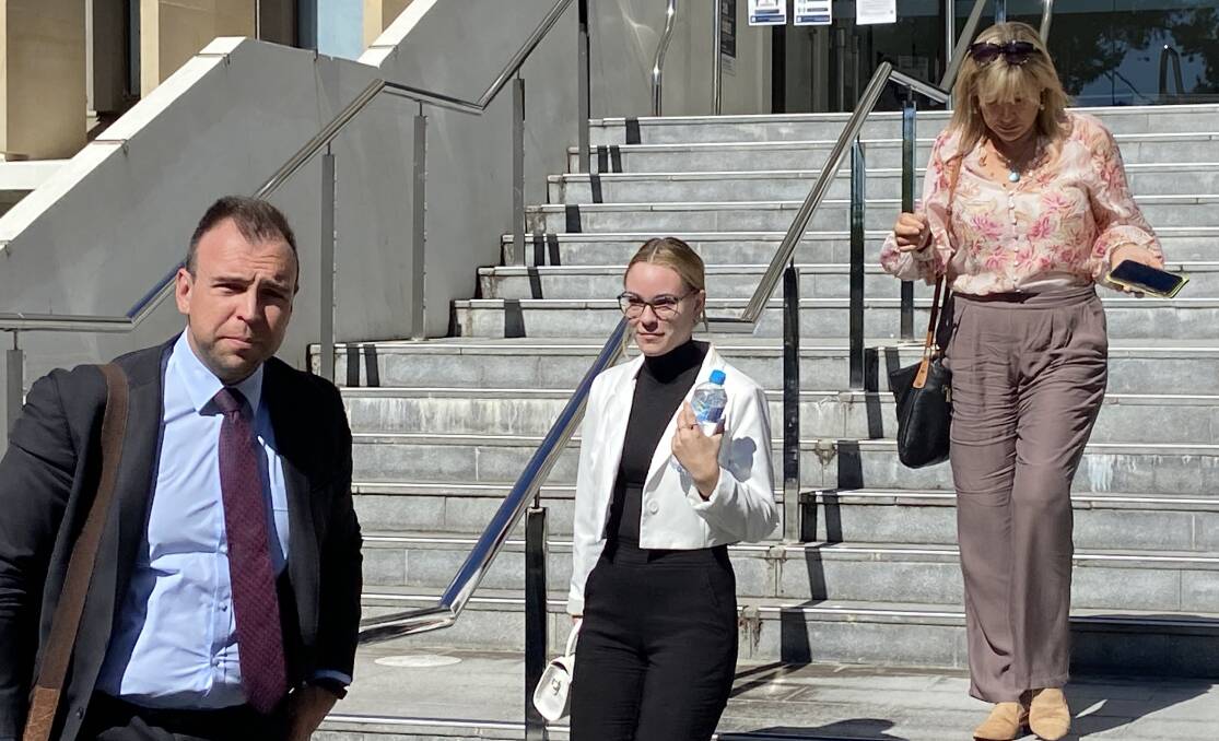 Lauren Pousderkos (middle) was supported by her mother and lawyer as she left Wollongong courthouse. Picture: Ashleigh Tullis